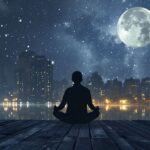 Person meditating on a wooden pier with a bright full moon and starry sky over a city skyline and calm lake.